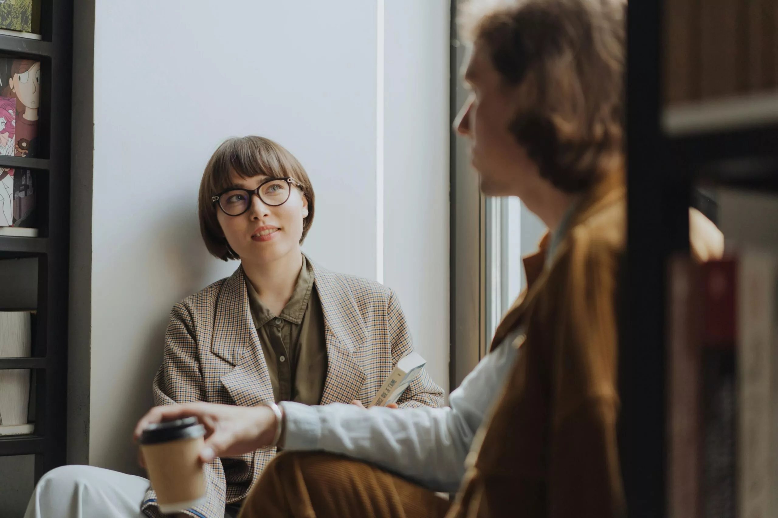 Men discussing communication styles together, highlighting directness and emotional expression.