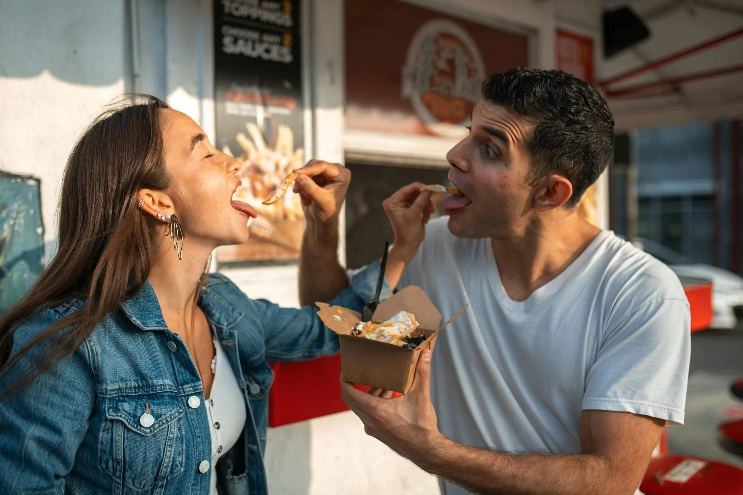 Couple participating in a cooking class to strengthen their romantic connection by learning and cooking together.